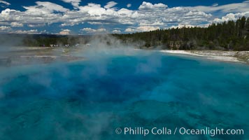 Excelsior Geyser, now dormant, was formerly the worlds largest geyser. It still produces immense runoff into the Firehole River: 4,500 gallons per minute, or 6 million gallons per day. It is located in Midway Geyser Basin.