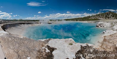 Panorama of Excelsior Geyser, now dormant, was formerly the worlds largest geyser. It still produces immense runoff into the Firehole River: 4,500 gallons per minute, or 6 million gallons per day. It is located in Midway Geyser Basin, Yellowstone National Park, Wyoming