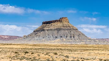 Factory Butte. An exceptional example of a solitary butte surrounded by dramatically eroded badlands, Factory Butte stands alone on the San Rafael Swell, Hanksville, Utah