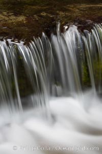 Fern Springs, a small natural spring in Yosemite Valley near the Pohono Bridge, trickles quietly over rocks as it flows into the Merced River. Yosemite Valley, Yosemite National Park, California