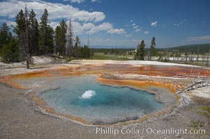 Firehole Spring bubbles and splashes continuously as superheated steam rises through the pool.  Firehole Spring is located along Firehole Lake Drive, Lower Geyser Basin, Yellowstone National Park, Wyoming