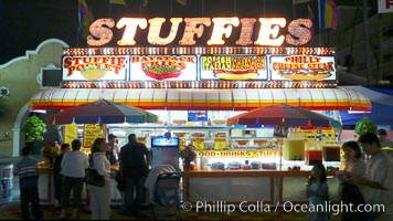Food vendors at the Del Mar Fair, famous for their tasty, greasy, salty, fattening and generally unwholesome food, which visitors eat by the ton.  Bright lights at night