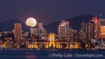 Full Moon rising over San Diego City Skyline, viewed from Harbor Island. Mount San Miguel is to the right, Lyons Peak to the left, in the distance.