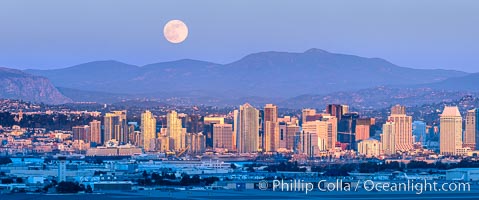 Full Moon Rises over San Diego City Skyline, viewed from Point Loma, panoramic photograph. The mountains east of San Diego can be clearly seen when the air is cold, dry and clear as it is in this photo.  Mount Laguna is the peak rising in the distance