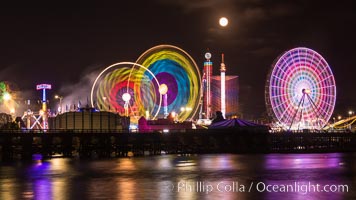 Full moon rising at night over the San Diego County Fair.  Del Mar Fair at night