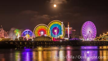 Full moon rising at night over the San Diego County Fair.  Del Mar Fair at night