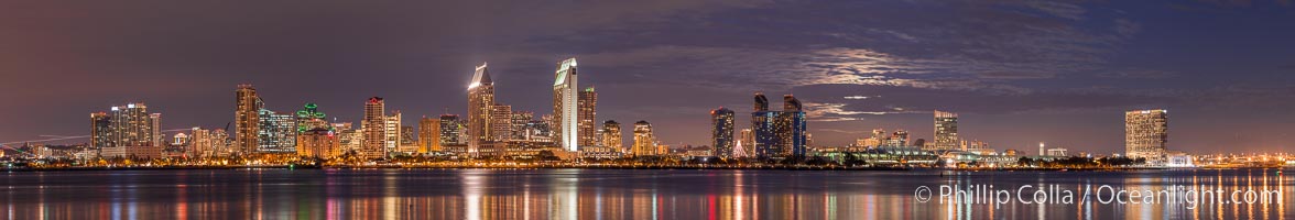 Full moon rising over San Diego city skyline, sunset, storm clouds, viewed from Coronado Island