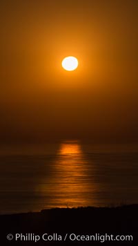 Full Moon setting over the Pacific Ocean