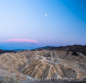 Full moon over Zabriskie Point landscape