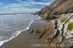 Shale is a fine-grained detrital sedimentary rock formed by the compaction of clay, silt, or mud.  Shale is formed when mud is pressed into rock over millions of years and often breaks into big flat pieces. Here layers of shale emerge from the sand and cliffs at Gaviota State Beach north of Santa Barbara