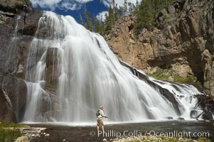 Fly fishing below Gibbon Falls. This flyfisherman hiked up the Gibbon River to reach the foot of Gibbon Falls, Yellowstone National Park, Wyoming