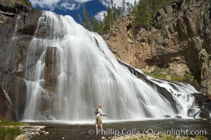 Fly fishing below Gibbon Falls. This flyfisherman hiked up the Gibbon River to reach the foot of Gibbon Falls, Yellowstone National Park, Wyoming