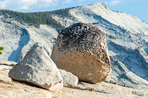 Glacial erratics atop Olmsted Point, with Clouds Rest in the background. Erratics are huge boulders left behind by the passing of glaciers which carved the granite surroundings into their present-day form, Yosemite National Park, California