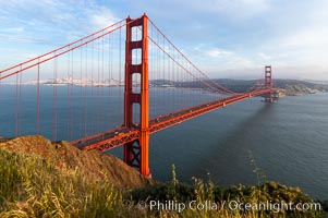 Golden Gate Bridge, viewed from the Marin Headlands with the city of San Francisco in the distance.  Late afternoon.