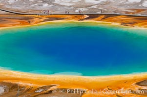 Grand Prismatic Spring displays a stunning rainbow of colors created by species of thermophilac (heat-loving) bacteria that thrive in narrow temperature ranges.  The blue water in the center is too hot to support any bacterial life, while the outer orange rings are the coolest water.  Grand Prismatic Spring is the largest spring in the United States and the third-largest in the world.  Midway Geyser Basin, Yellowstone National Park, Wyoming