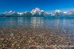 Rocky shallows in Jackson Lake with Mount Moran in the background, Grand Teton National Park, Wyoming