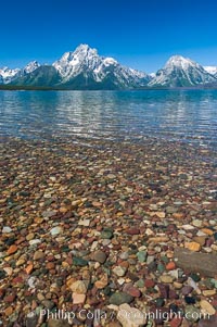 Rocky shallows in Jackson Lake with Mount Moran in the background, Grand Teton National Park.