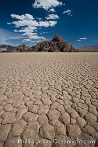 The Grandstand, standing above dried mud flats, on the Racetrack Playa in Death Valley, Death Valley National Park, California