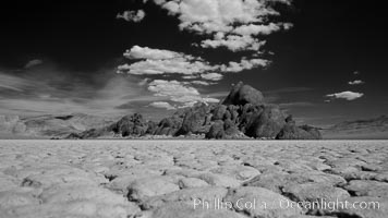 The Grandstand, standing above dried mud flats, on the Racetrack Playa in Death Valley, Death Valley National Park, California