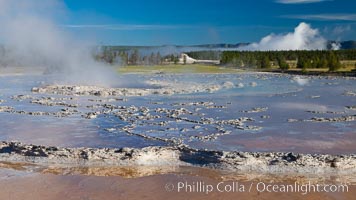 Great Fountain geyser.  Great Fountain geyser's large vent (16 feet across) sits amid wide sinter terraces that act as reflecting pools as the geyser slows fills prior to its eruption, Lower Geyser Basin, Yellowstone National Park, Wyoming