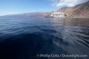 Guadalupe Island, cliffs rising above north end of the island over glassy seas, Guadalupe Island (Isla Guadalupe)