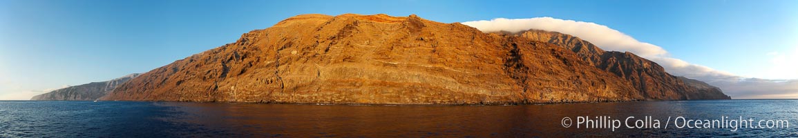 Guadalupe Island at sunrise, panorama.  Volcanic coastline south of Pilot Rock and Spanish Cove, near El Faro lighthouse, Guadalupe Island (Isla Guadalupe)