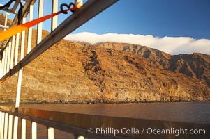 Guadalupe island at sunrise, viewed through the bars of an aluminum shark cage, Guadalupe Island (Isla Guadalupe)