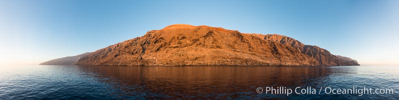 Guadalupe Island at sunrise, panorama. Volcanic coastline south of Pilot Rock and Spanish Cove, near El Faro lighthouse, Guadalupe Island (Isla Guadalupe)