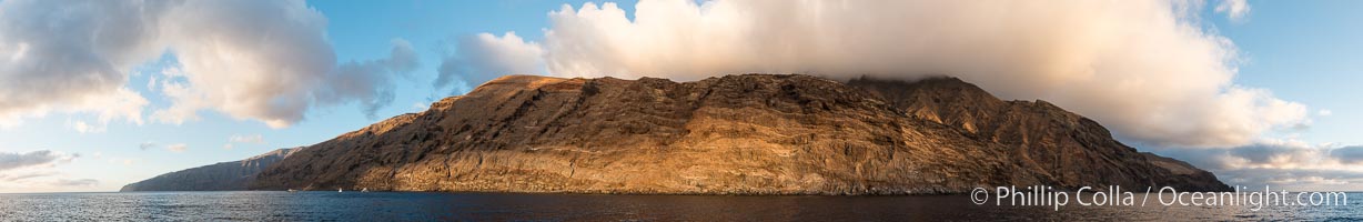 Guadalupe Island at sunrise, panorama. Volcanic coastline south of Pilot Rock and Spanish Cove, near El Faro lighthouse. Guadalupe Island (Isla Guadalupe), Baja California, Mexico.