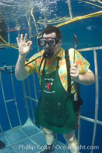 A Canadian television chef waves to the camera from a shark cage at Guadalupe Island.  Huh?, Guadalupe Island (Isla Guadalupe)