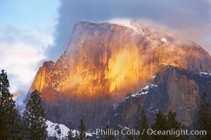 Half Dome and storm clouds at sunset, viewed from Sentinel Bridge, Yosemite National Park, California