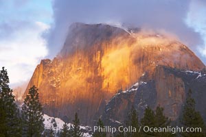 Half Dome and storm clouds at sunset, viewed from Sentinel Bridge, Yosemite National Park, California