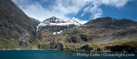 Hercules Bay, with the steep mountains and narrow waterfalls of South Georgia Island rising above