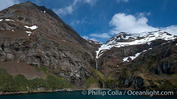 Hercules Bay, with the steep mountains and narrow waterfalls of South Georgia Island rising above