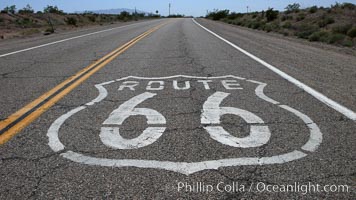 Route 66 (also known as U.S. Route 66, The Main Street of America, The Mother Road and the Will Rogers Highway) was a highway in the U.S. Highway system. One of the original federal routes, US 66 was established in 1926 and originally ran from Chicago through Missouri, Kansas, Oklahoma, Texas, New Mexico, Arizona, and California, before ending at Los Angeles for a total of 2,448 miles.  US 66 was officially decommissioned (i.e, removed from the offical U.S. Highway system) in 1985 after it was decided the route was no longer relevant and had been replaced by the Interstate Highway System