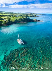 Honolua Bay in West Maui aerial photo, morning, with snorkel boat at anchor, panorama