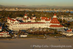 Hotel del Coronado, known affectionately as the Hotel Del.  It was once the largest hotel in the world, and is one of the few remaining wooden Victorian beach resorts.  It sits on the beach on Coronado Island, seen here with downtown San Diego in the distance.  It is widely considered to be one of Americas most beautiful and classic hotels. Built in 1888, it was designated a National Historic Landmark in 1977.