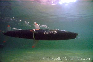 The OMER 5 human-powered submarine, designed, built and operated by Montreal, Canadas École de Technologie Supérieure (University of Quebec) engineering students.  The submersible is 16 feet long and has two people inside powering and piloting the sub.  Made of high tech composite materials and containing networked computers, the OMER 5 has reached a speed of nearly 7 knots underwater, a world record for human-powered submarines, Offshore Model Basin, Escondido, California