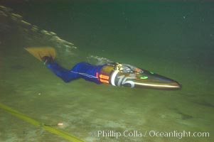 A human-powered submarine, composed off a streamlined casing which encloses half the operator as well as his air supply.  The operator kicks a single large monofin to propel the sleek submersible.  It was designed, built and operated by Virginia Tech engineering students, Offshore Model Basin, Escondido, California