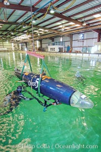 The OMER 5 human-powered submarine is raised from the Offshore Model Basin in Escondido California.  The sub was designed, built and operated by Montreal, Canadas École de Technologie Supérieure (University of Quebec) engineering students.  The submersible is 16 feet long and has two people inside powering and piloting the sub.  Made of high tech composite materials and containing networked computers, the OMER 5 has reached a speed of nearly 7 knots underwater, a world record for human-powered submarines