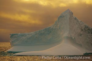 Iceberg, ocean, light and clouds.  Light plays over icebergs and the ocean near Coronation Island.