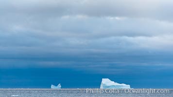 Iceberg, ocean, light and clouds.  Light plays over icebergs and the ocean near Coronation Island.