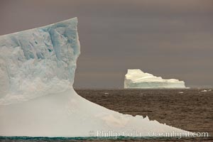 Iceberg, ocean, light and clouds.  Light plays over icebergs and the ocean near Coronation Island.