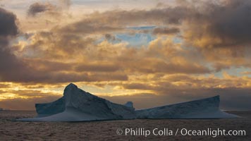 Iceberg, ocean, light and clouds.  Light plays over icebergs and the ocean near Coronation Island