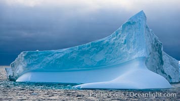 Iceberg, ocean, light and clouds.  Light plays over icebergs and the ocean near Coronation Island