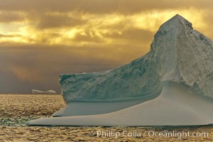 Iceberg, ocean, light and clouds. Light plays over icebergs and the ocean near Coronation Island