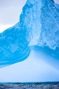 Iceberg, ocean, light and clouds.  Light plays over icebergs and the ocean near Coronation Island.