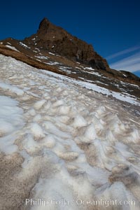 Crested snow patterns along the slopes of Devil Island.