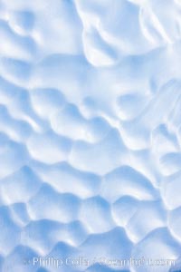 Iceberg with scalloped erosion.  The eroded indentations on this iceberg were melted when this portion of the iceberg was underwater.  As it melted, the iceberg grew topheavy, eventually flipping and exposing this interesting surface, Paulet Island