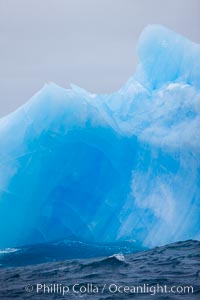 A blue iceberg.  Blue icebergs are blue because the ice from which they are formed has been compressed under such enormous pressure that all gas (bubbles) have been squeezed out, leaving only solid water that takes on a deep blue color, Scotia Sea